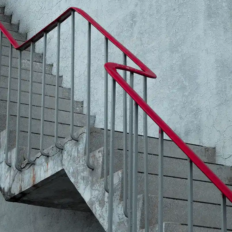Abstract architectural image with geometric patterns and red accents